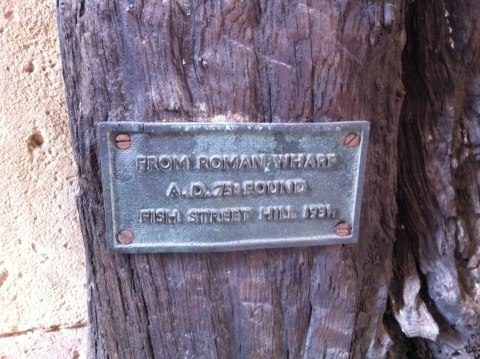 Sign reads From Roman Wharf AD75 Found Fish Street Hill 1991